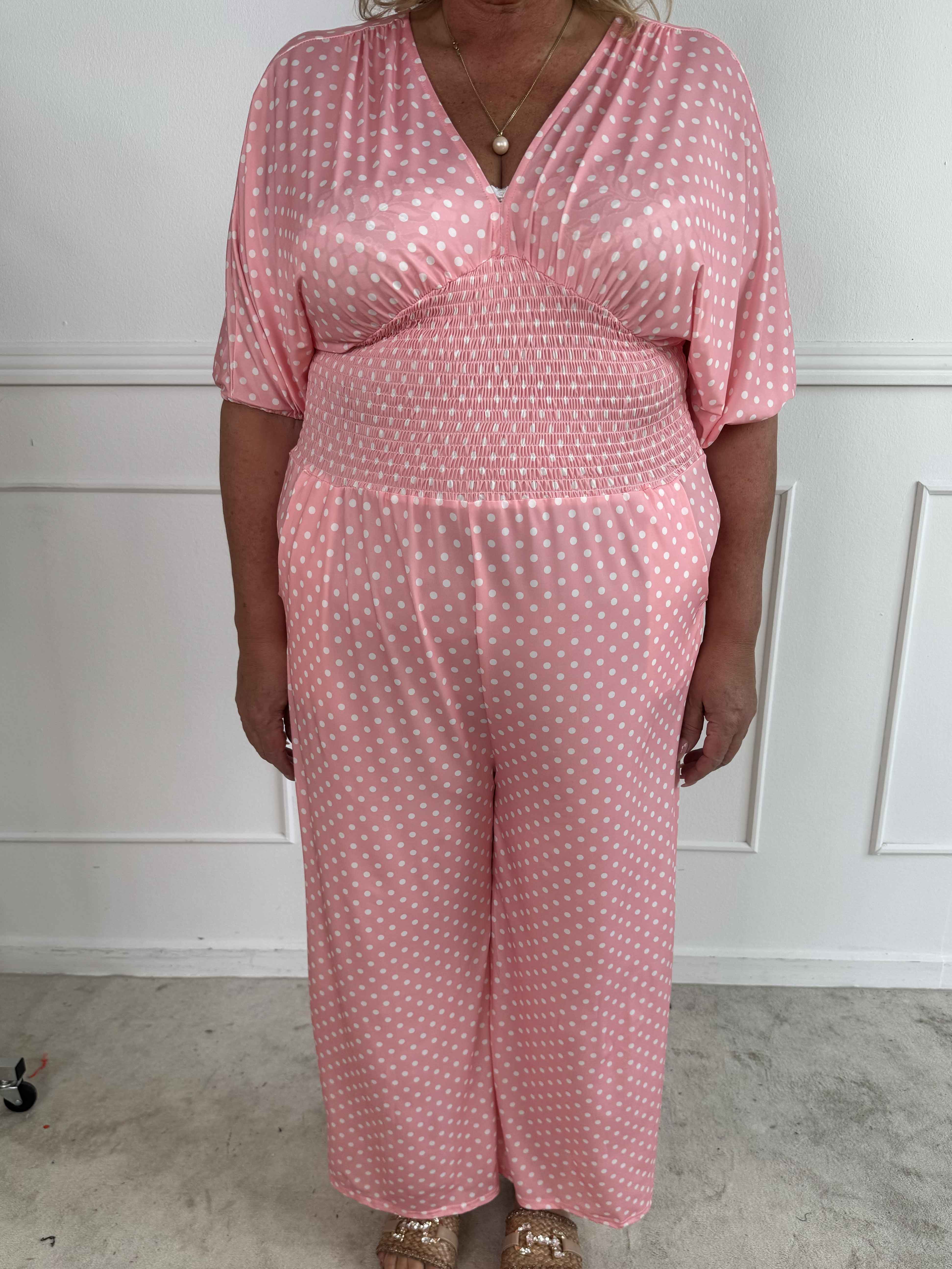 Grace - Stretchig plus size jumpsuit med vita prickar
